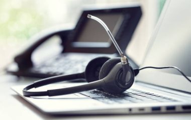 VOIP headset headphones telephone and laptop concept for communication, it support, call center and customer service help desk